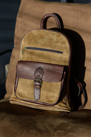 leather backpack on chair, close up.の写真素材