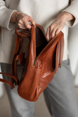 photo of a orange leather backpack with retro look. indoors photoの写真素材