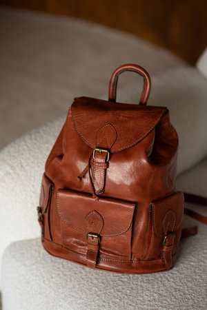 photo of a orange leather backpack with retro look. indoors photoの写真素材