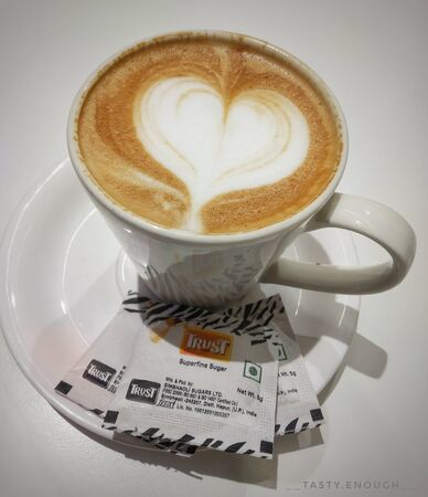 Hot coffee cappuccino cup isolated on white backgroundの写真素材