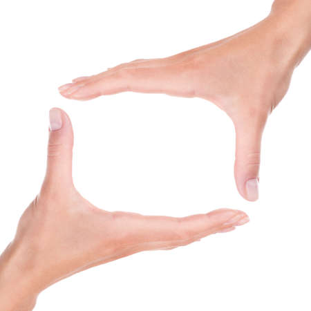 Two female hands framing a abstract frame square border isolated white backgroundの写真素材