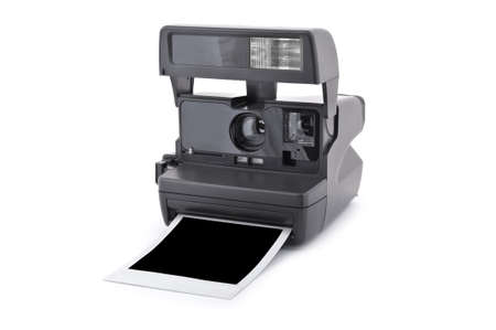 Vintage instant film camera with blank instant photo Isolated on a white backgroundの写真素材