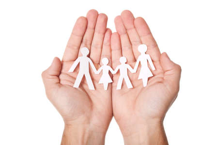 Paper family in hands isolated on white backgroundの写真素材