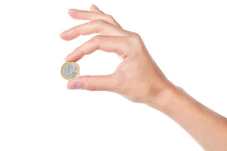 Hand holding 1 Euro coin, isolated on white backgroundの写真素材