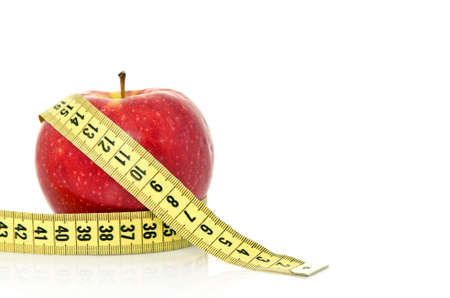 Red fresh apple with tape on white background (health and diet concept)の写真素材