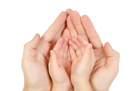 Adult hand hold kid's handful isolated on white backgroundの写真素材