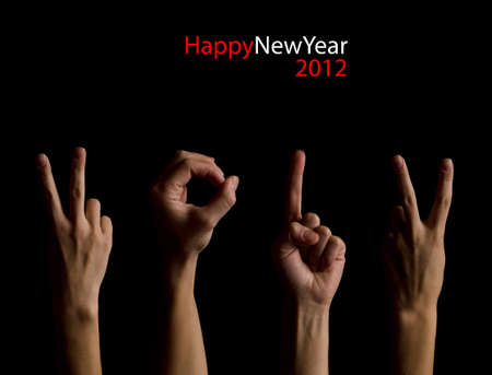 The number 2012 shown by fingers in creative New Year greeting cardの写真素材