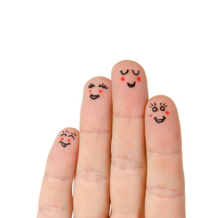 Faces painted on fingers isolated on whiteの写真素材
