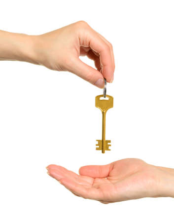 Hands and key isolated on white background の写真素材