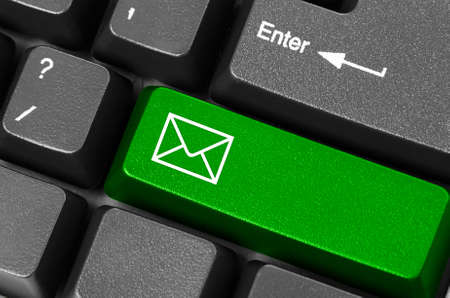 Keyboard with green email button の写真素材