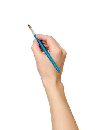 Hand with a brush isolated on white backgroundの写真素材