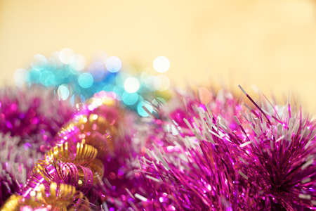 Close-up of different Christmas tinsel, pink, blue, yellow. Glittersの写真素材