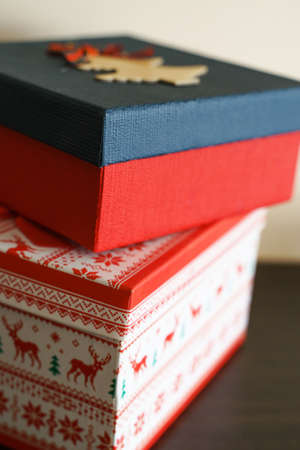 Red Christmas gift boxes with reindeer print