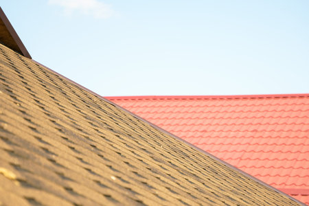 Photo from above on the nearest roof covered with soft tiles. The far roof is covered with ondulin tiles.の写真素材