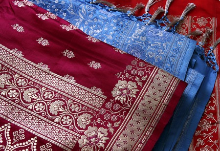 Closeup of golden embroidery on Indian saree.