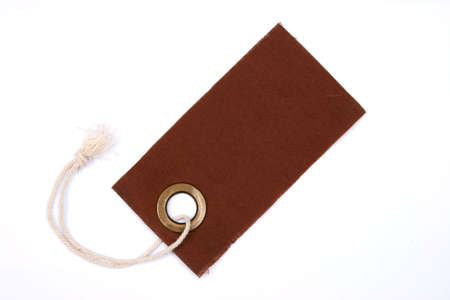 Brown tag isolated over white. の写真素材