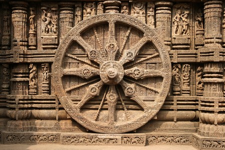 Intricate carvings on a stone wheel in the ancient Surya Hindu Temple at Konark, Orissa, India. 13th Century ADの写真素材