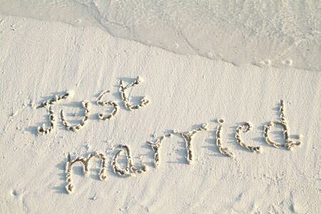 'Just Married' written in sand.の写真素材