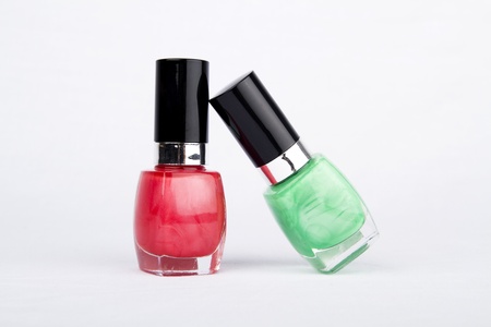 Group of nail polishes of different colors on white backgroundの写真素材