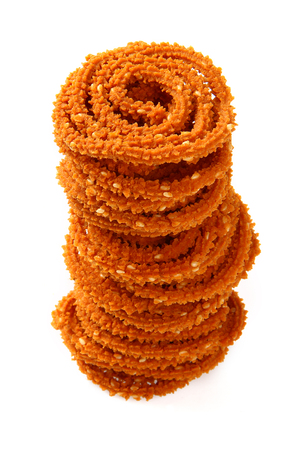 Traditional indian snack - chakali, isolated on white の写真素材