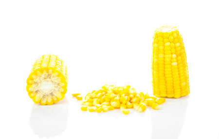 Sweet whole kernel corn and ears of corn on white background