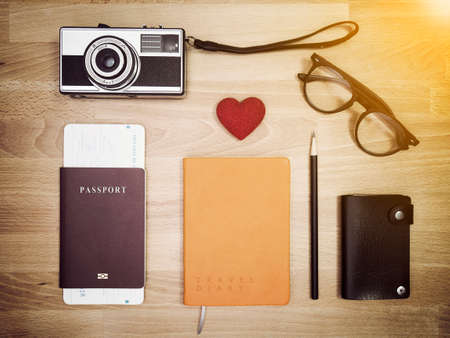 Travel accessories on wooden background , flat lay. Travel background.の写真素材