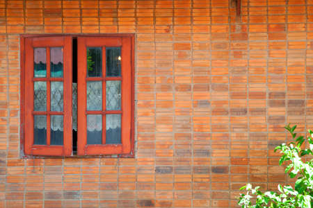 Vintage simple house old brick wall and rustic exterior window shutters at countryside in Asiaの写真素材