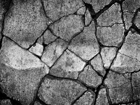 abstract background of texture of dry cracked cement ground on the roadの写真素材
