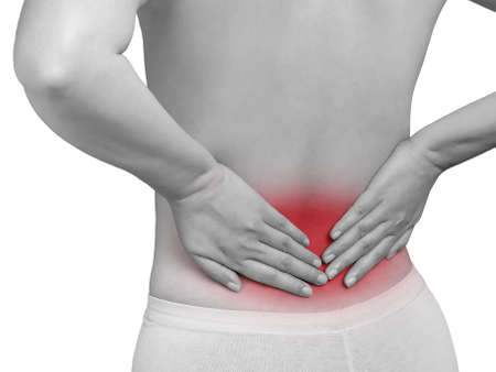 woman suffering from backache. mono tone color highlight at back isolated on white background, studio shot. health care and medical conceptの写真素材