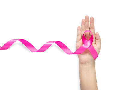 woman hand holding pink ribbon, Breast cancer awareness symbol. isolated on white background with clipping pathの写真素材