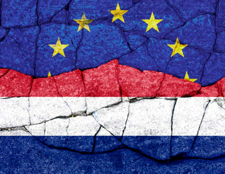 flags of EU and Netherlands painted on cracked wallの写真素材