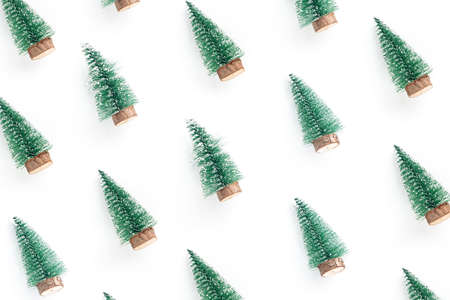 minimal composition pattern background of green christmas tree isolated on white background