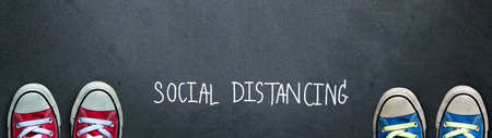 Social distance. two people keep spaced between each other for social distancing, increasing the...