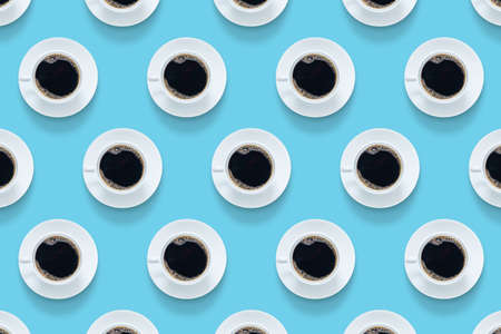 hot espresso brew on white coffee cup with saucer repeat pattern isolated on blue background