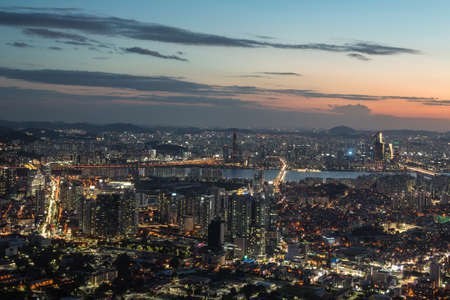 Sunset over Seoul cityscape, Korea's capital city. Shot from the top of the Namsan mountain in the heart of the city.の写真素材