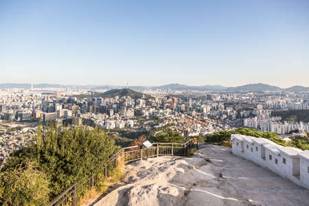 An aerial view of Seoul, South Korea capital city, from an hill north of the city that offers various popular hiking trails along the old fortress wall and good views.のeditorial素材