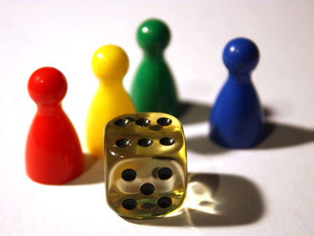 4 pieces of a board game and 1 dice