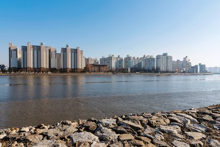buildings along a seafront in Incheon South Koreaの写真素材
