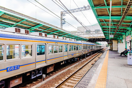 OSAKA, JAPAN - JANUARY 21: Kitanoda railway station on the outskirts of Osaka is a typical Japanese rural railway station which can take people straight to the city center on January 21, 2016 in Osaka.のeditorial素材