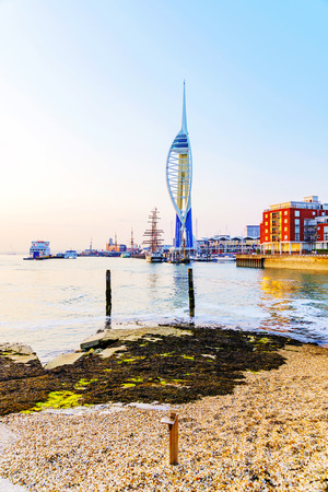 PORTSMOUTH, UNITED KINGDOM - JUNE 06: Portsmouth Emirates Spinaker tower taken from a distance on a pebble beach at sunset on June 06, 2016 in Portsmouth.のeditorial素材