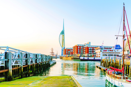 PORTSMOUTH, UNITED KINGDOM - JUNE 06: Portsmouth Emirates Spinaker tower in the distance with shipping harbor at sunset on June 06, 2016 in Portsmouth.のeditorial素材