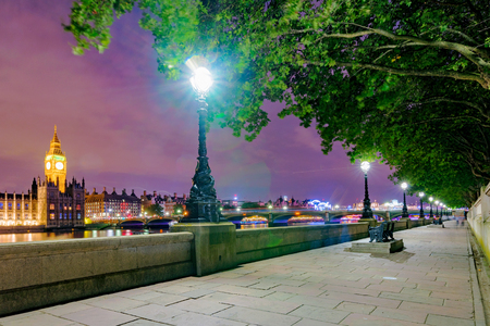 Riverside path at night with view of Londonの写真素材