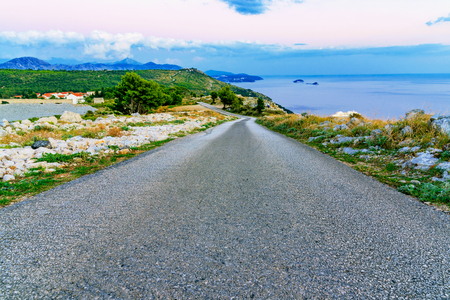 Mountain road with scenic view in the eveningの写真素材