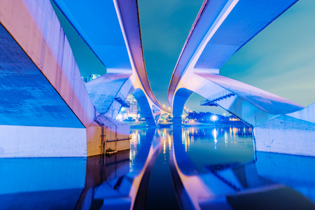 River view of a bridge in Taipei at nightの写真素材