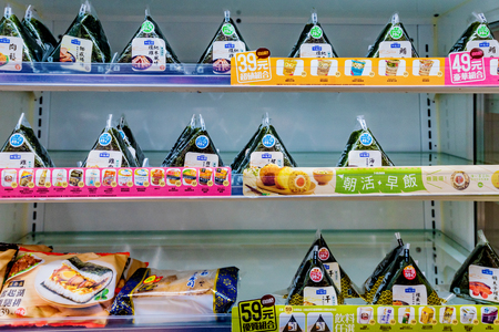 TAIPEI, TAIWAN - JUNE 26: This is a fridge of rice triangles and other cold sushi which are very common in convenience stores across Taiwan on June 26, 2017 in Taipeiのeditorial素材