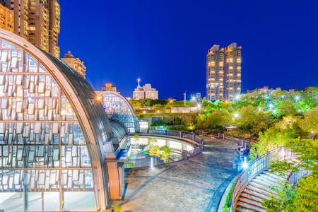 TAIPEI, TAIWAN - JULY 15: This is a night view of Daan Forest Park station and city architecture in the downtown area on July 15, 2017 in Taipeiのeditorial素材