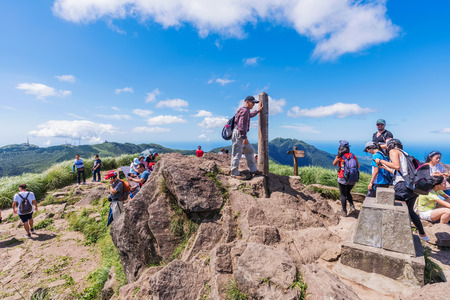 TAIPEI, TAIWAN - JULY 16: Tourists at the top of Cising peak which is situated in Yangmingshan national park a popular mountain amongst travellers and locals on July 16, 2017 in Taipeiのeditorial素材