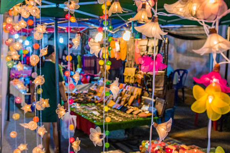 CHIANG MAI, THAILAND - JULY 30: Night market scene of flower lights and out of focus stalls in the backround in the famous weekend market on July 30, 2017 in Chiang Maiのeditorial素材