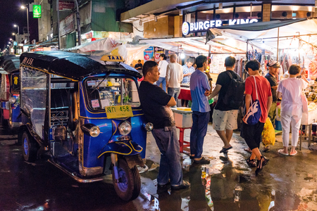 CHIANG MAI, THAILAND - JULY 30: This is a night market scene with a tuk tuk driver waiting for passengers on July 30, 2017 in Chiang Maiのeditorial素材