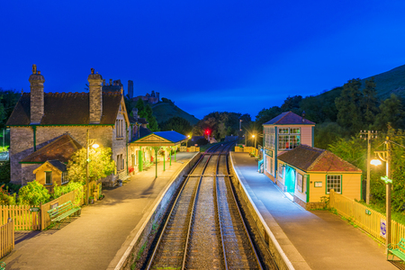 CORFE, UNITED KINGDOM - SEPTEMBER 08: This is a night view of the Corfe Castle railway station traditional medieval architecture and train tracks on September 08, 2017 in Corfeのeditorial素材
